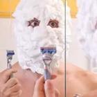 Shaving with a lot of shaving cream
