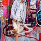 Boy with bike and graffiti