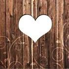 A brown wooden wall with a white heart in the middle