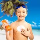 Boy with Sunscreen Suntan Lotion