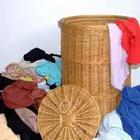 A basket filled with clothes around it