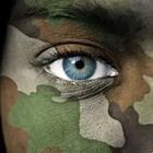 A person wearing military paint on their face