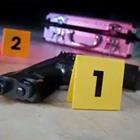 A gun next to a yellow number one and two