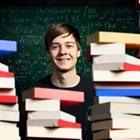 A person standing behind a pile of books