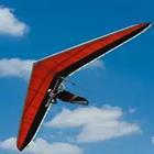 A red glider in the air