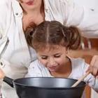 A child looking into a pot