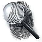 A finger print with a magnify glass over it