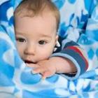 A baby in blue blankets