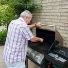 A man cooking on the grill