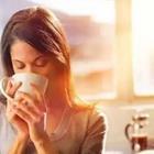 Woman drinking glass of coffee