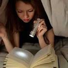 Reading with flashlight