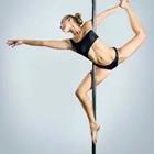 Woman stretching on pole