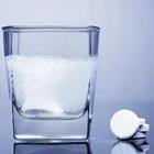 Cup of water with white tablet fizz