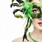Woman wearing green mask with feathers