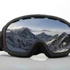 Snowboarding and skiing goggles with reflection of mountains