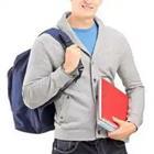 Guy wearing backpack and carrying book