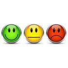 A green smiley face, A yellow face, and a red sad face