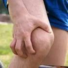 A person clutching their knee