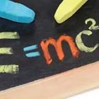 A chalkboard with an equation on it