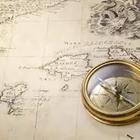 A map with a gold compass