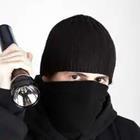 Robber in Black with Flashlight