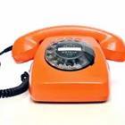 An orange rotary phone