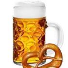 A beer with a pretzle next to it