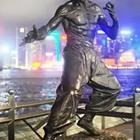 A statue of a man doing karate