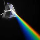 A silver object beaming out different colors