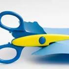A blue and yellow scissors cutting something