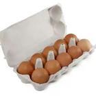 A box filled with brown eggs
