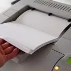 Sheets of paper coming out of a printer