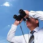 A person looking through binoculars