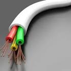 Red and green and yellow wires hanging out of a white tube