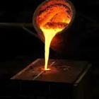 A metal object pouring something hot