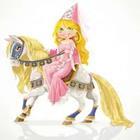 A cartoon figure on a horse with a pink dress on
