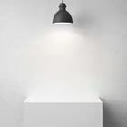 A white light shinning on a white desk