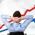 Man sitting in front of rising graph