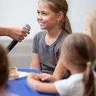 Girl speaking into microphone