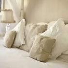 A bed with white pillows