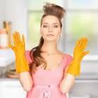 A woman with yellow gloves on