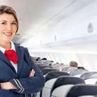 A flight attendant posing by seats