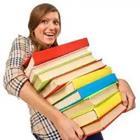 Girl holding pile of books