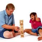 Father and son playing jenga