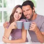 Man and woman drinking coffee, mugs
