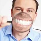 Man’s smile with magnifying glass