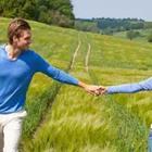 Holding hands in field
