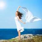 Woman in white with blanket swaying in wind