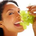 Girl eating grapes
