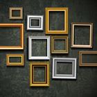 A wall filled with picture frames
